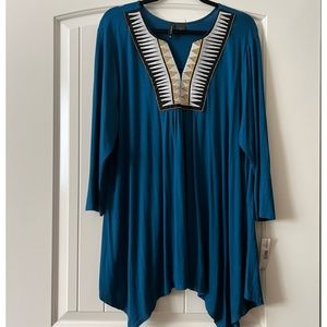 Royal blue tunic. Top is soft with gold, black and white detailing at neck.